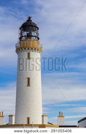 The Mull Of Galloway Lighthouse In Dumfries And Galloway, Scotland, United Kingdom Under A Blue Sky 