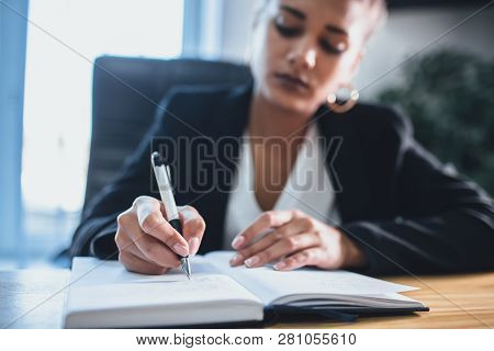 Young Pretty Smart Business Girl Works In The Office. During This, It Creates Important Steps For Co