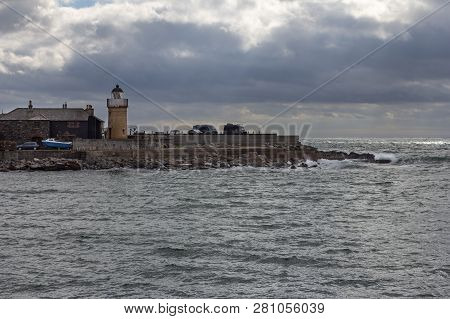 Portpatrick Harbor On An Overcast Day In Scotland, United Kingdom
