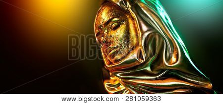 Beautiful gold makeup model girl face portrait. Close up of beauty woman with glamour golden foil makeup isolated on black background in colorful lights. Arabian Muslim dress, hijab, burka, niqab