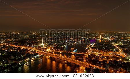 White Prayoon Pagoda, Memorial Bridge, And Phra Pok Klao Bridge With Buildings And Curve Of Chao Phr