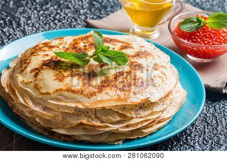 Stack Of Yeast Pancakes, Traditional For Russian Pancake Week Witn Red Cavier And Honey