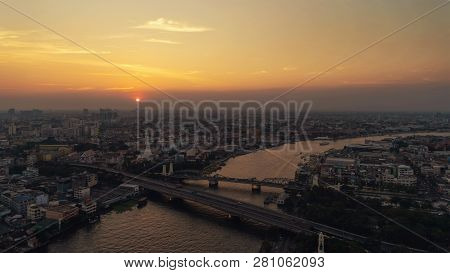 White Prayoon Pagoda, Memorial Bridge, And Phra Pok Klao Bridge With Buildings And Curve Of Chao Phr