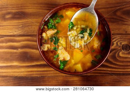 Kharcho Soup With Meat And Rice On Wooden Table. Top View
