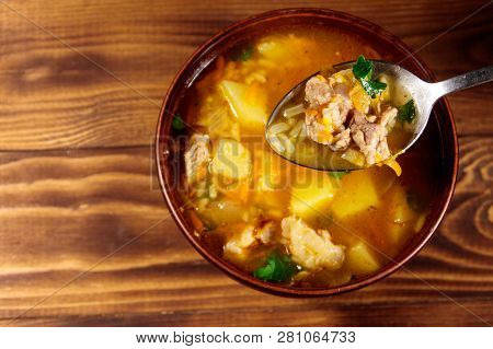 Kharcho Soup With Meat And Rice On Wooden Table. Top View
