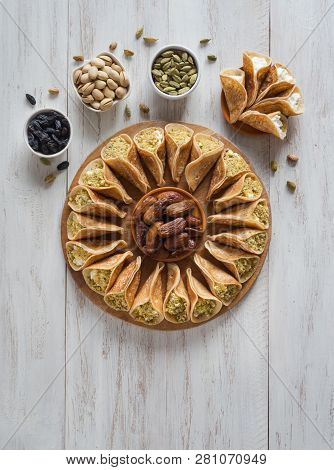 Arab Sweets. Arabian Pancake Stuffed With Sweet Cheese And Pistachios.