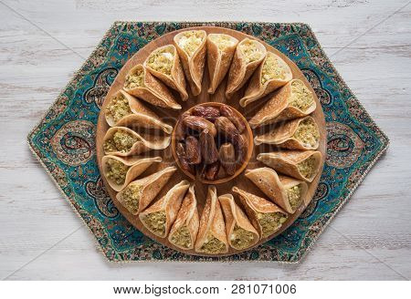 Arab Sweets. Arabian Pancake Stuffed With Sweet Cheese And Pistachios.