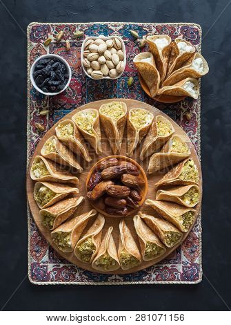 Arab Sweets. Arabian Pancake Stuffed With Sweet Cheese And Pistachios.