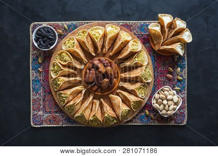 Arab Sweets. Arabian Pancake Stuffed With Sweet Cheese And Pistachios.