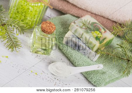 Natural Cosmetic Oil, Sea Salt, Facial Mask And Natural Handmade Soap With Coniferous Extract On Whi