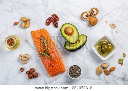 Selection Of Healthy Unsaturated Fats, Omega 3 - Fish, Avocado, Olives, Nuts And Seeds