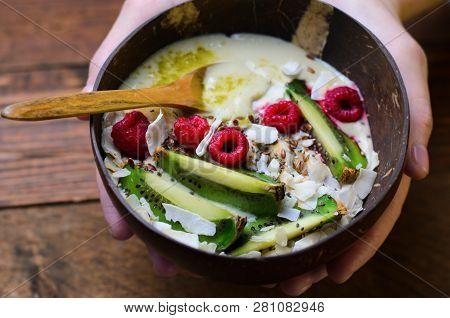Smoothie Bowl Topped With Raspberry, Kiwi, Chia, Flaxseed And Coconut