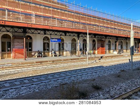 Luino, Varese, Italy - January 28, 2019: Platform With Passengers At Luino Railway Station, Is A Bor