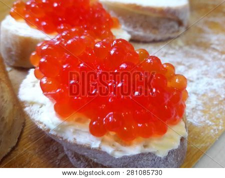 Bread Is Black. White, In Slices. Narzen Bread. On A Tree A Tree. On The Table. For Background. For 