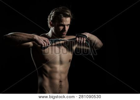 Belt In Hands Of Naked Man. The Guy Does Exercises For Hands With Leather Belt. Sexy Model For Mens 