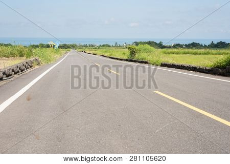road at green paddy farm in the countryside