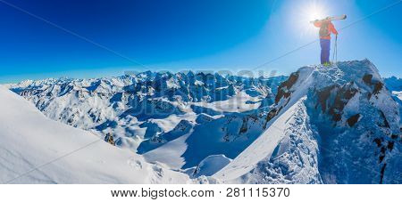 Skitouring with amazing view of swiss famous mountains in beautiful winter powder snow of Alps. 