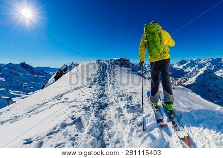 Skitouring with amazing view of swiss famous mountains in beautiful winter powder snow of Alps. 