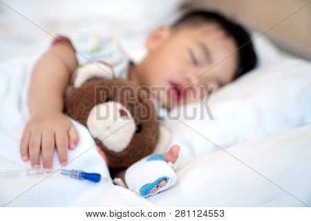 Asian Baby Sleep With Teddy Bear And Saline On The Bed In Hospital, This Immage Can Use For Faver, C