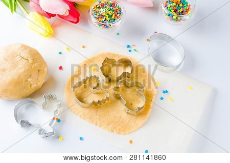 Easter Cooking Background, Dough And Indredients, Cuts For Cookies And Colored Sugar Décor For Bakin