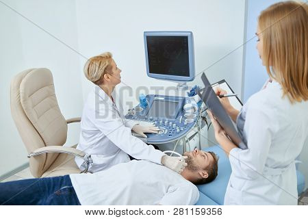 Young Man Laying On Bed During Observation On Medical Concultation In Private Clinic. Professional D