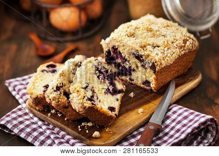 Lemon And Blueberry Crumble Loaf Cake On Rusic Background