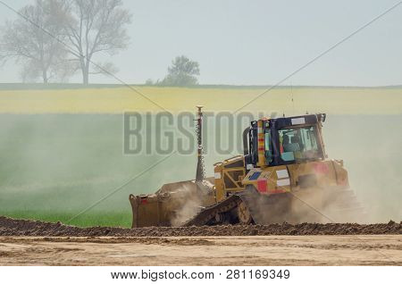 Bulldozer - The Vehicle At Work On Construction Site