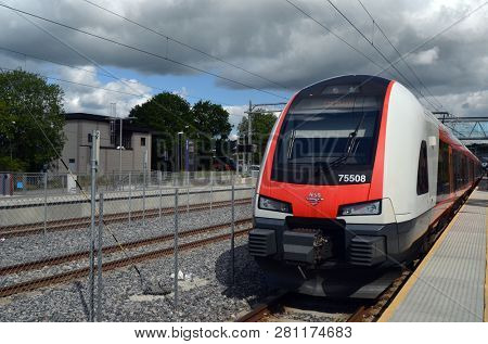 Platform and train view on Rakkestad railway station. June 16. 2018. Rakkestad,Norway