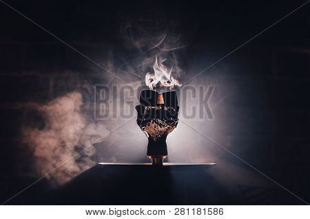Hookah Bowl With Flawoured Tobacco And Red Hot Coconut Coil On The Black Background With Light Close