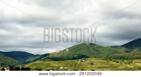 Picturesque Alsace Landscape With Chateau Giersberg And Saint Ulrich Ruins On Dramatic Sky Backgroun