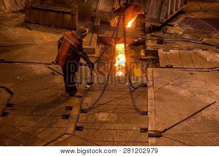Steelworker Near A Blast Furnace At Work