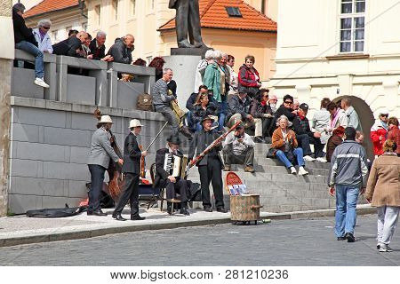 Prague, Czech - April 24, 2012: Unidentified Street Musicians Play For The Public On Hradchany Squar