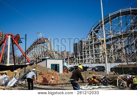Brookyln, New York - May 10, 2018: A Construction Crew Works Outside Near Luna Park In Coney Island 