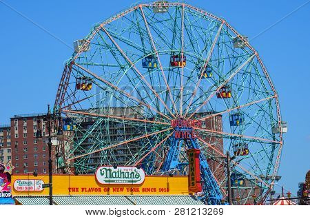 Brookyln, New York - May 10, 2018:  View Of Nathans Hot Dogs And Luna Park Wonder Wheel From The Bea