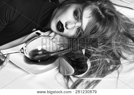 Sensual Elegant Glamour Young Drunk Woman With Beautiful Hair Lying On Table With Glass And Poored R