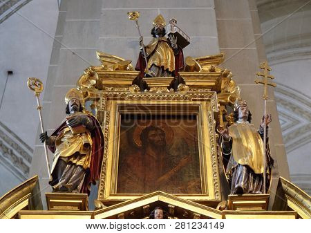 LUCERNE, SWITZERLAND - JUNE 24, 2018: Saint John the Baptist surrounded by the statues of Saints, Saint Henry altar in the church of St. Leodegar in Lucerne, Switzerland
