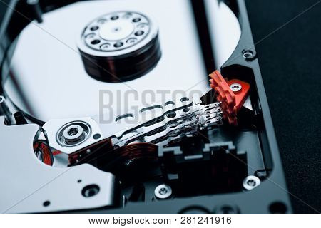 Closeup Inside The Assembly Of Hard Disk Drive Actuator Arm With Read/write Head And Multi-layer Mag