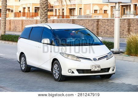 Dubai, Uae - November 18, 2018: White Minivan Toyota Previa In The City Street.