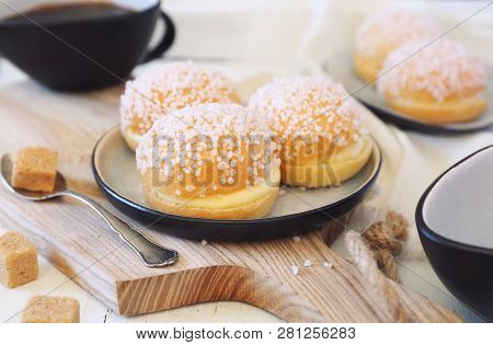 French Dessert Pastry. Mini Tarts Tropezienne And Cup Of Coffee On Light Background