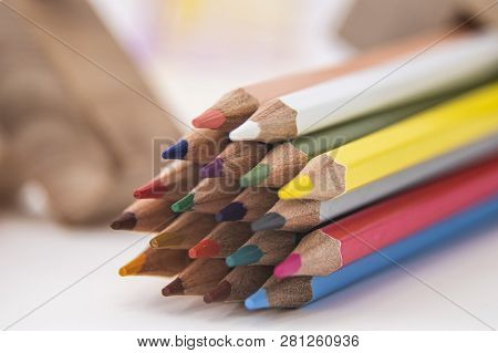 Wooden Colored Pencils On A White Background