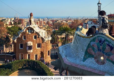 View From The Mosaic Serpentine Bench Of The Park Guell To The Casa Del Guarda Gatehouse And Panoram