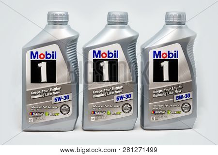 Grouping Of Three Mobil 1 Motor Oil Containers
