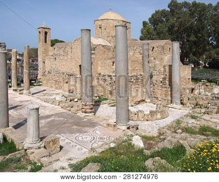 The Historic Church Of Yia Kyriaki Chrysopolitissa In Paphos Cyprus Showing The Building And The Sur