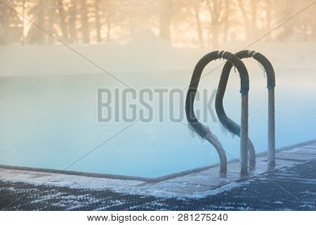 Warm Swimming Pool Hand Rail In Frosty Weather, Outdoor, Soft Focus On Stainless Steel Stair Railing