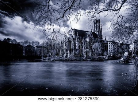 An Old Church Behind A Frozen Lake