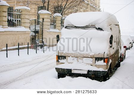 Parked Cars Covered In Snow After Snowstorm. Bad Weather, Snowfall In The City. Winter In St. Peters