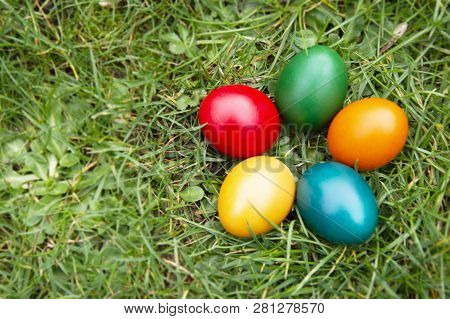 Easter Colorful Eggs In Fresh Green Grass. - Yellow, Green, Red, Orange And Blue Eggs. Spring, Easte