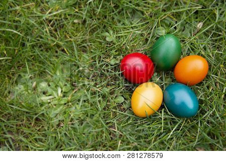 Easter Colorful Eggs In Fresh Green Grass. - Yellow, Green, Red, Orange And Blue Eggs. Spring, Easte