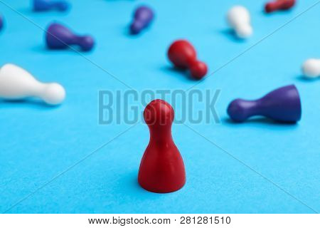 Red Pawn Standing Alone And Other Fallen Down On Table. Victory Concept