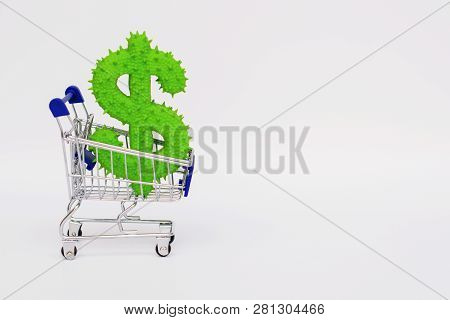 American Dollar Rubber Toy In A Mini Grocery Cart On A White Background.